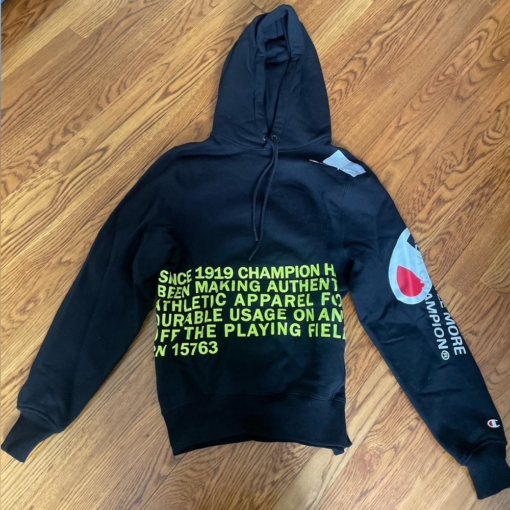 Champion Black Hoodie with Neon Yellow Graphic and Accent Blue/Red Sleeve Logo